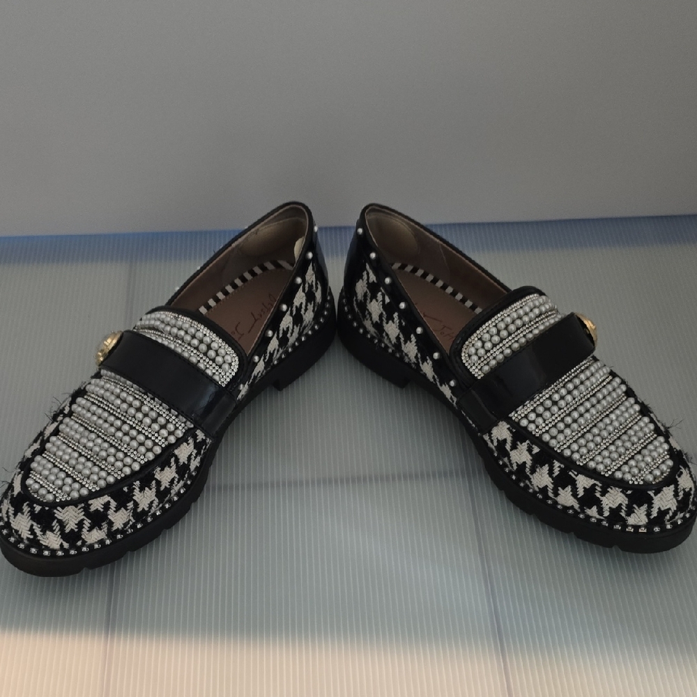 Black and White Woman's Loafers